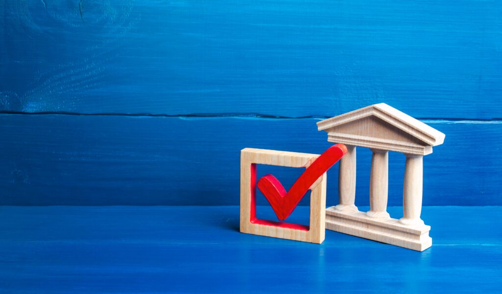 Government building and red check mark. Presidential / parliamentary democratic elections, referendum. Social poll. Rights and freedoms, rule of law. Government legitimacy, recognition. Institution