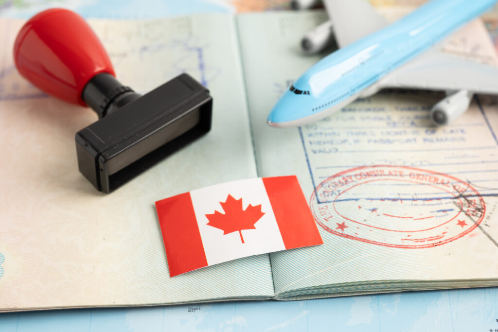 Canada flag with approved Stamp visa and passport document to im