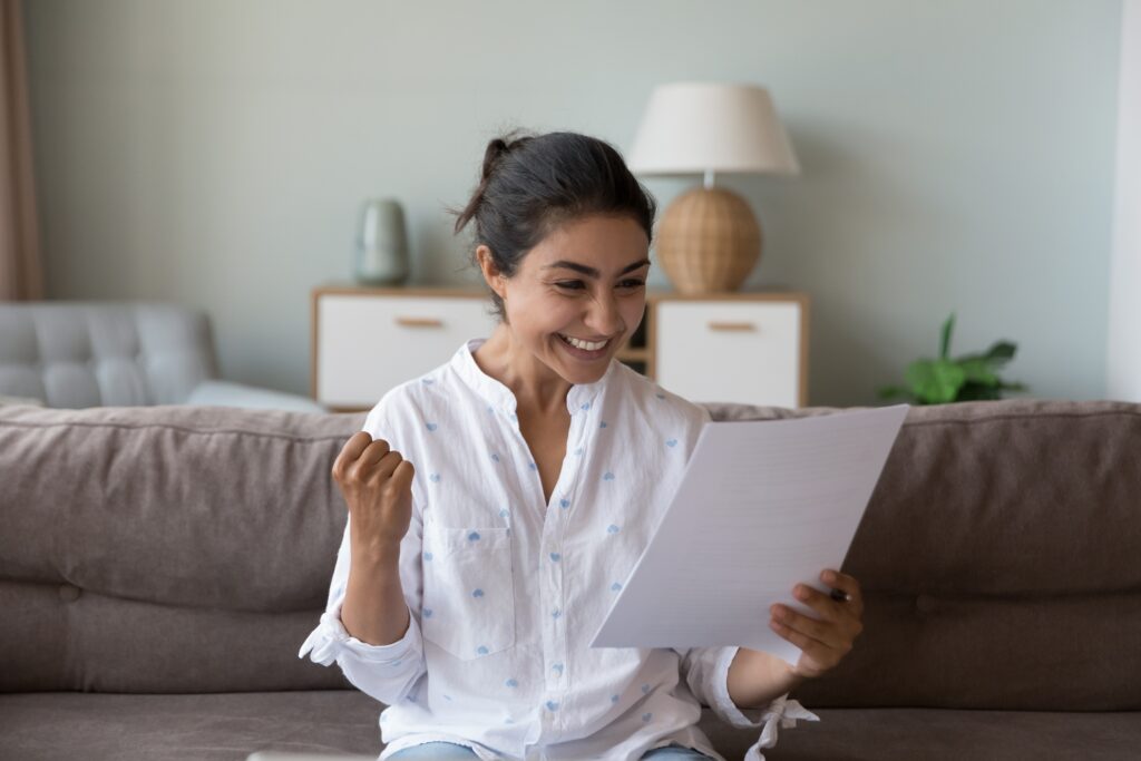 Excited,Cheerful,Young,Indian,Woman,Getting,Good,News,Letter,,Reading