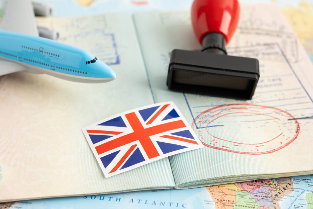 United Kingdom flag with approved Stamp visa and passport docume