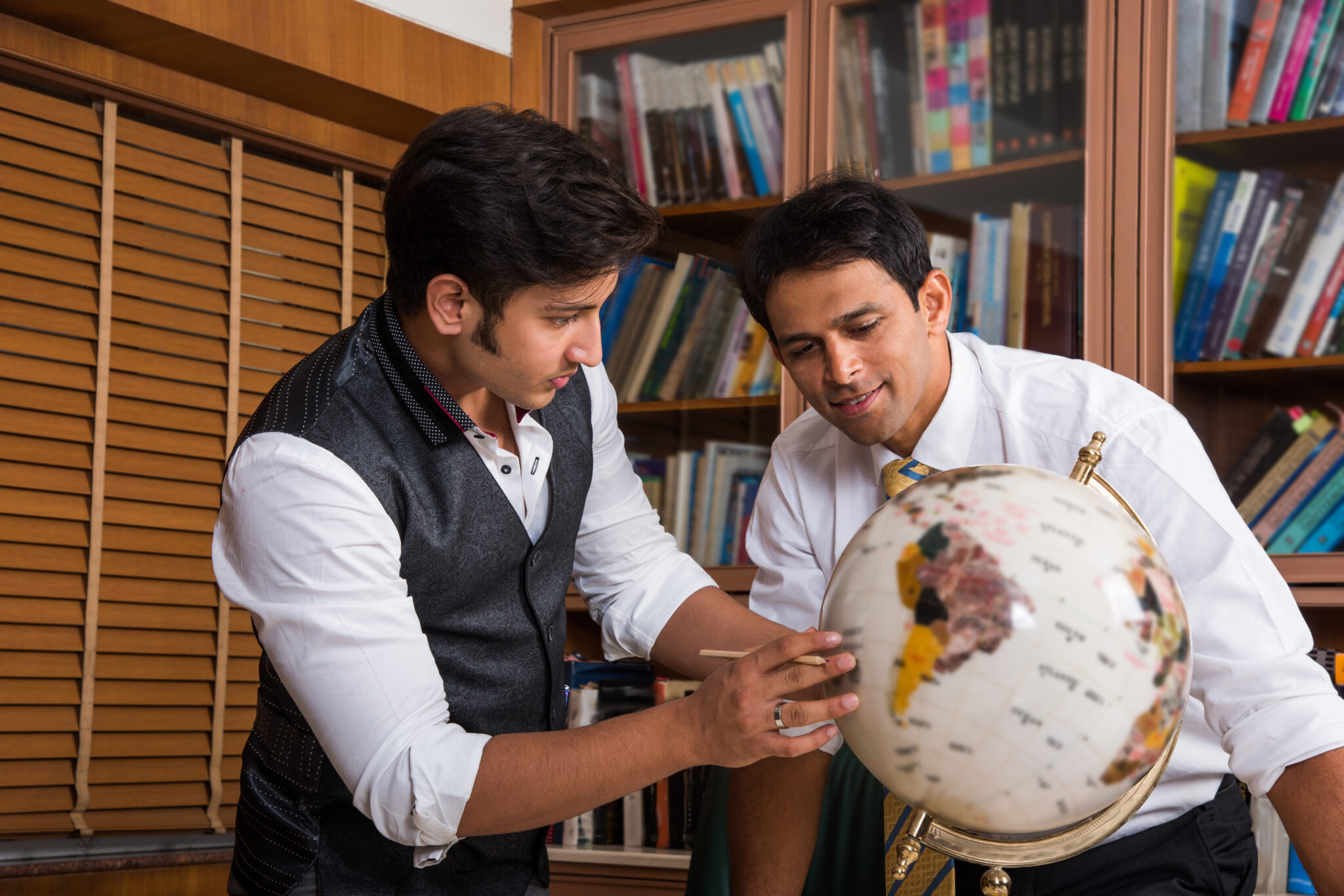 Indian Business People or Corporate culture and Working in the office looking at globe 3D model