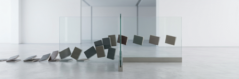 A minimal editorial cover image showing a clean, modern security checkpoint setup with a single transparent glass barrier, where multiple identical documents approach from one side but only a few pass through a narrow opening and continue forward, soft natural lighting, neutral tones (white, grey, muted blue), no text, no flags, no icons, very few elements, ultra-realistic photography style, strong negative space, precise composition, symbolizing selective visa approval and filtering of serious applicants.